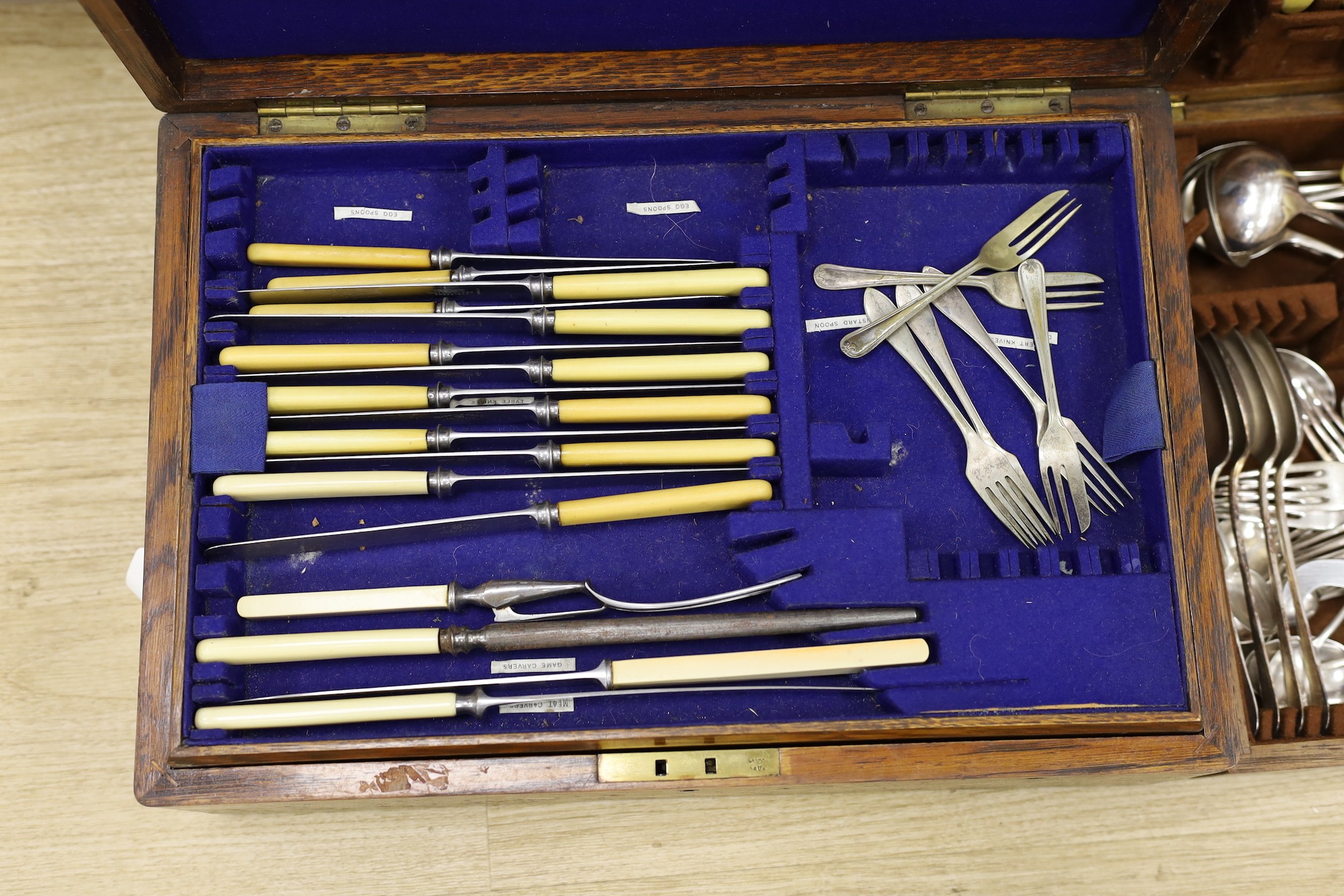 Two Mappin and Webb oak cased part cased plated canteens of cutlery